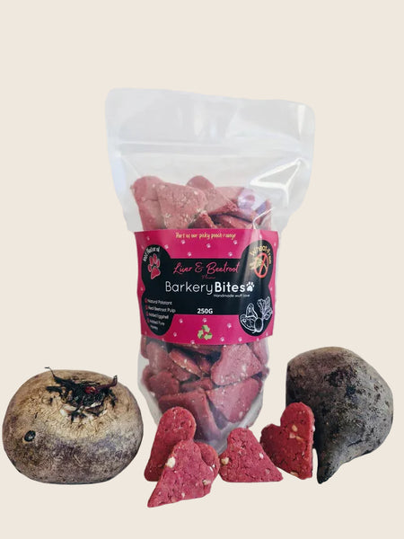 Packaging of Barkery Bites Wheat Free Liver & Beetroot dog treats with the product visible in front, showcasing the treats and a beetroot with a sprinkle of natural palatant.