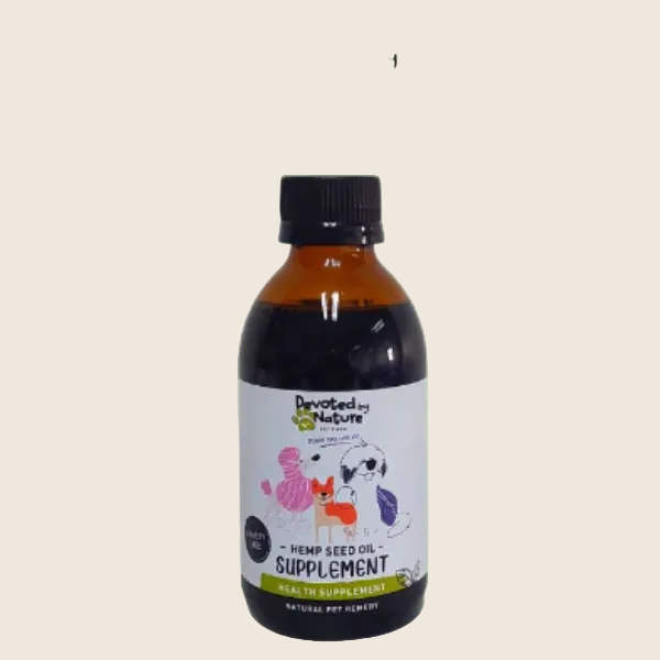 Bottle of Devoted by Nature hemp seed oil supplement on a green background