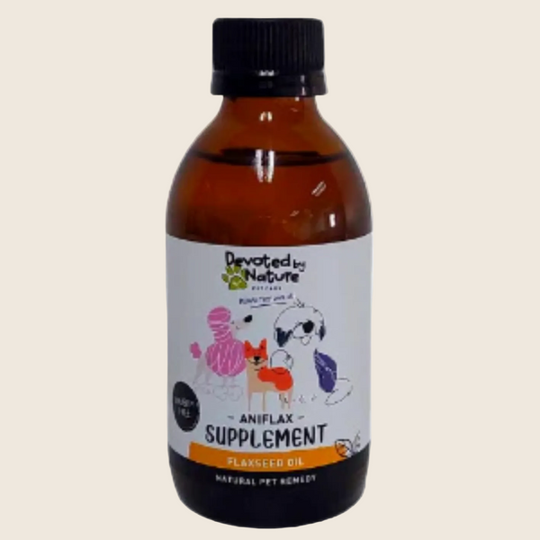 An amber glass bottle of Devoted by Nature Pets Aniflax Supplement Planted Seed Oil with a black cap and a white label featuring cartoon dog illustrations.